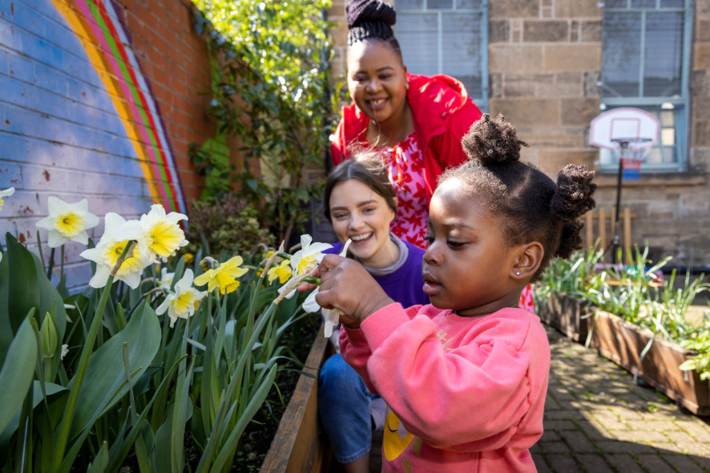 Girl with volunteer and mum